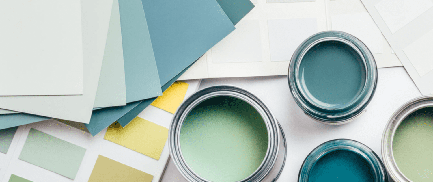 Paint cans and color samples for interior and exterior painting projects.